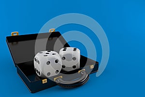 Dice inside black briefcase