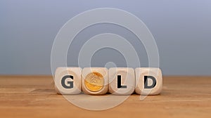 Dice and a Krugerrand coin form the word `GOLD`