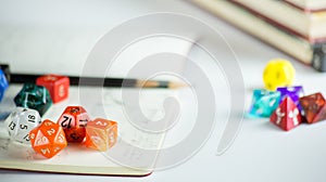 Dice with Pencils and a Notebook
