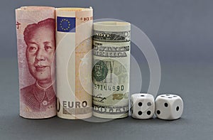 Dice placed with three currencies