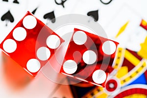Dice and playing cards with poker hand
