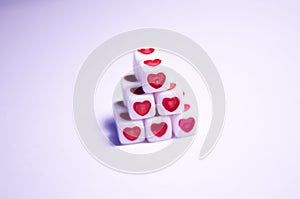 Dice pyramid with hearts. Cubes with hearts and letters. The 14th of February. Hearts on white cubes. Dice beads. Love