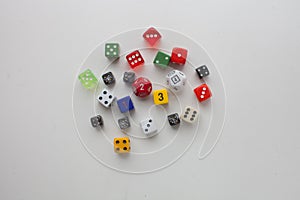 Dice rolled multiple colors on solid background