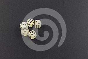 Dice scattered on a black gaming table
