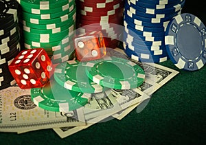 Dice and stacks of chips on money in a poker club. A successful combination brought a rich win