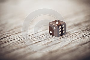 Dice on table, vintage effect. Background for casino games, gambling, luck or randomness. Rolling the dice concept for business