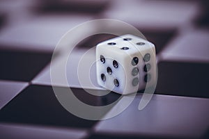 Dice on table, vintage effect. Background for casino games, gambling, luck or randomness. Rolling the dice concept for business