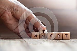 Dice with text for illustration of `smart and start` words