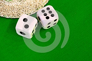 Dice white on green cloth or cloth