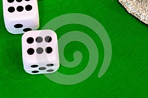 Dice white on green cloth or cloth