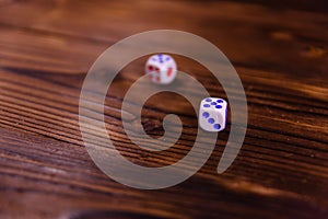 Dice on a wooden table. Gamble concept