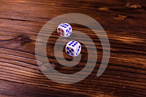 Dice on a wooden table. Gamble concept