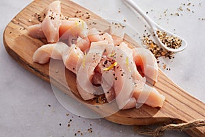 Diced fresh raw chicken breast cut in strips