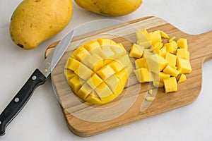 Diced Mango on a Wood Cutting Board