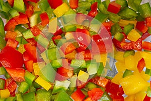 Diced yellow green and red peppers