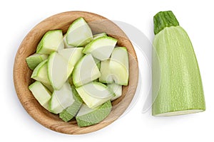 Diced zucchini or marrow in wooden bowl isolated on white background with clipping path and full depth of field. Top