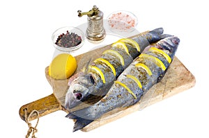 Dicentrarchus labrax fish with lemon for cooking.