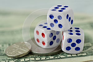 Dices on dollar money background - Concept of risky investments and gamble