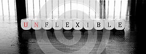 Word unflexible or flexible - dilema concept photo
