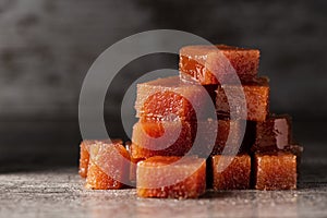 Dices of quince cheese on a table