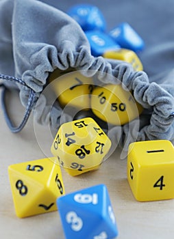 Dices for rpg, board games, tabletop games or dungeons and dragons. Gray bag, or pouch.