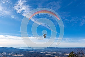 Dickey Ridge, Virginia, A paraglider catches the wind and glides over the Shenandoah Mountains