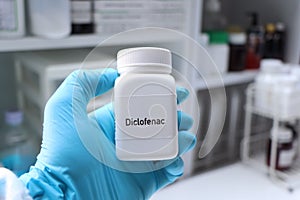 Diclofenac pill in white bottle, pill stock