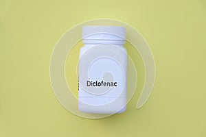 Diclofenac pill in white bottle, pill stock