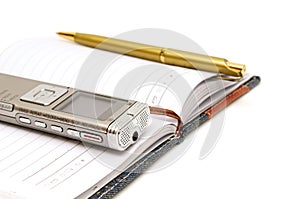 Dictaphone, notepad and ballpen