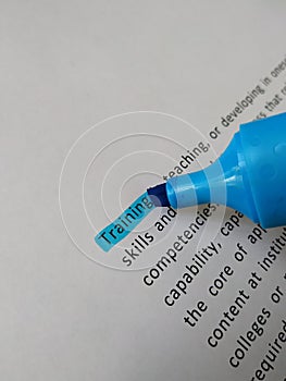 Dictionary definition of the word Training highlighted with blue marker pen