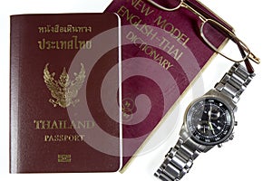 Dictionary Thailand with watches and passport