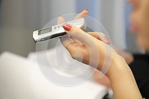 Dictophone in a female hand.