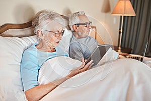 Did you see the news this morning. a senior couple sitting in bed together and using technology in a nursing home.