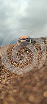 diecast car in the desert