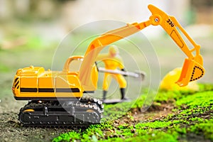 Diecast Construction Toys, Excavator Toys and Construction Worker with Shovel photo