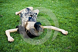 Died or resting woman in the grass photo