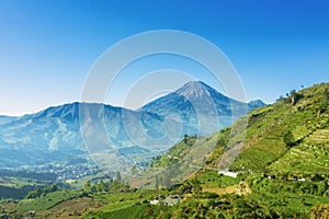 Dieng Plateau with Mount Sindoro background