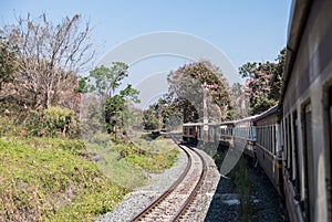 The diesel-electric locomotive is moving pass the signal pole