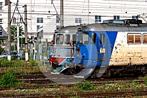 Diesel and electric locomotives in a train station