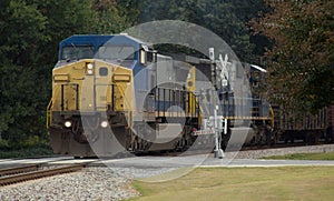 Diesel locomotive with safety crossing arms