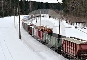 Diesel locomotive with wagons locomotive rides by rail in winter