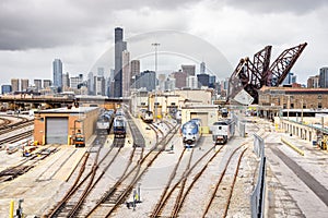 Diesel locomotives at a train depot on a cloudy spring day