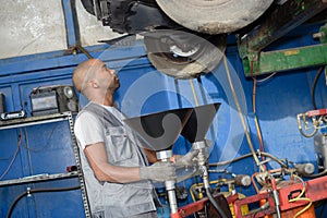 Diesel mechanic inspecting vehicle