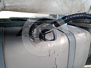 Diesel refueling gun in truck tank