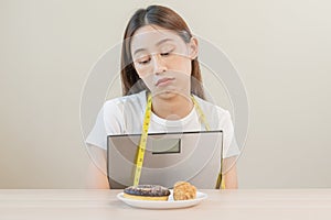 Diet, attractive asian young woman, girl restrained to eat doughnut, bakery and fried chicken, fast food to lose, loss weight,