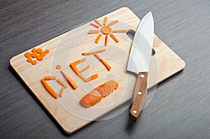 Diet concept. design food. word diet carrots on a cutting board