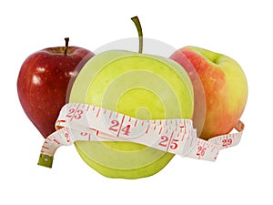 Diet concept with a green apple and a measure tape