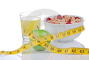 Diet concept:tape measure, apple, glass of juice