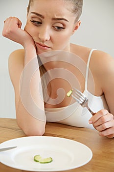 Diet. Dieting concept. Healthy Food. Beautiful Young Woman eats photo