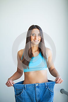 Diet. Dieting concept. Woman in Sportswear Measuring Her Waist